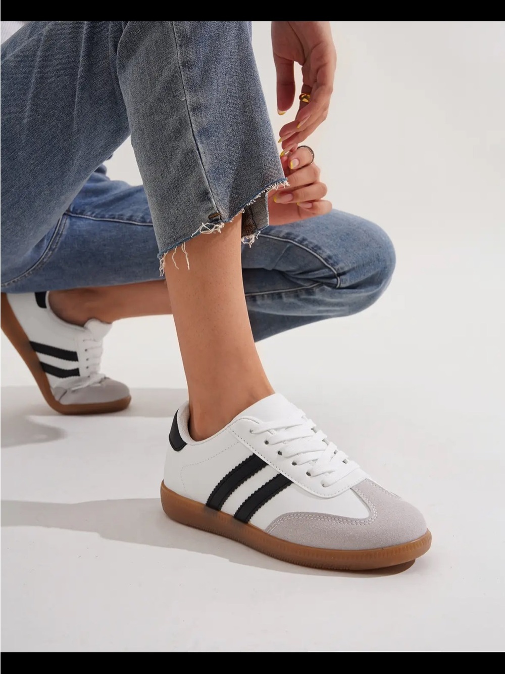 Classic White Low-Top Sneakers with Black Stripes